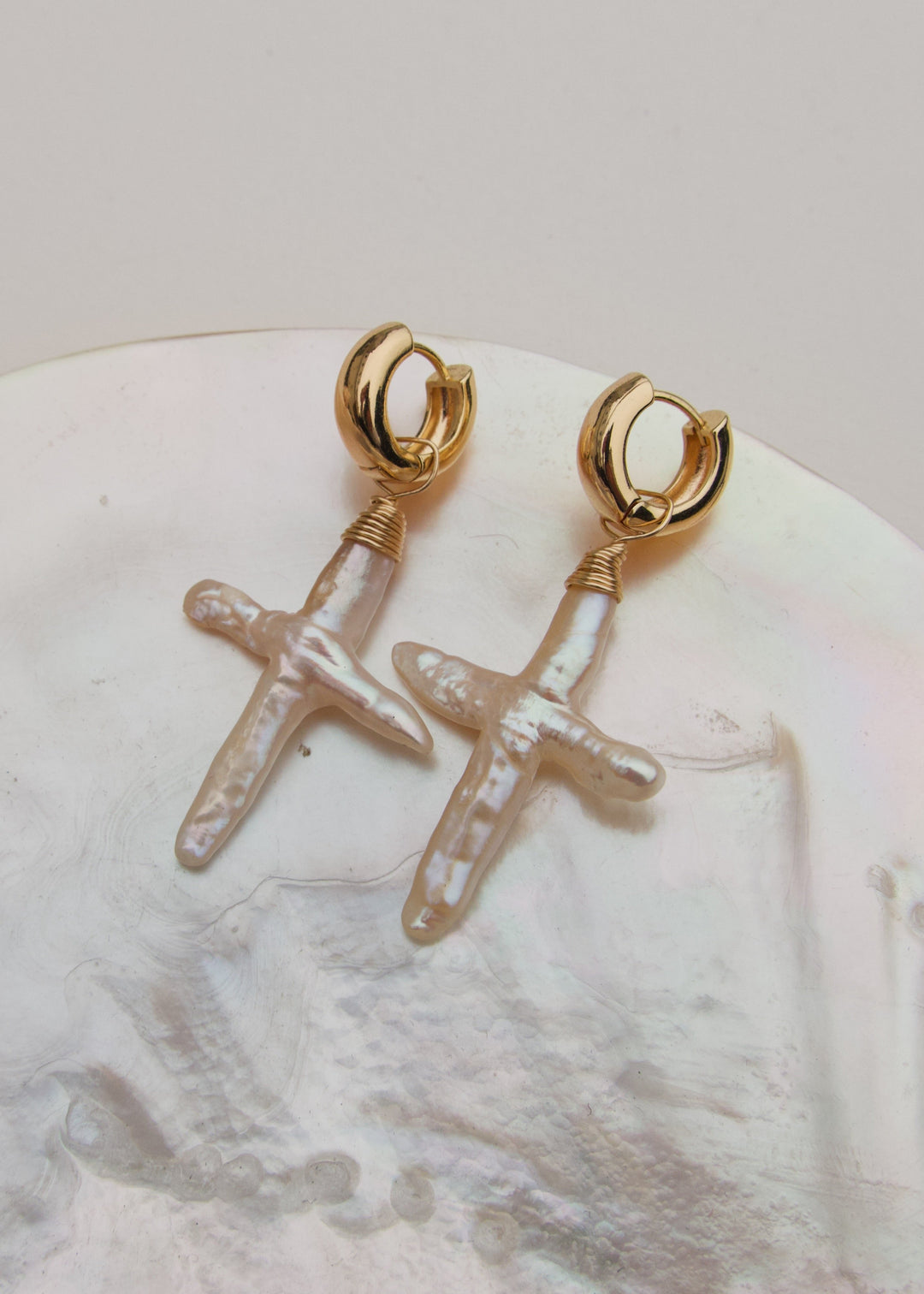 Unique earring with gold-filled small hoop and baroque pearl cross