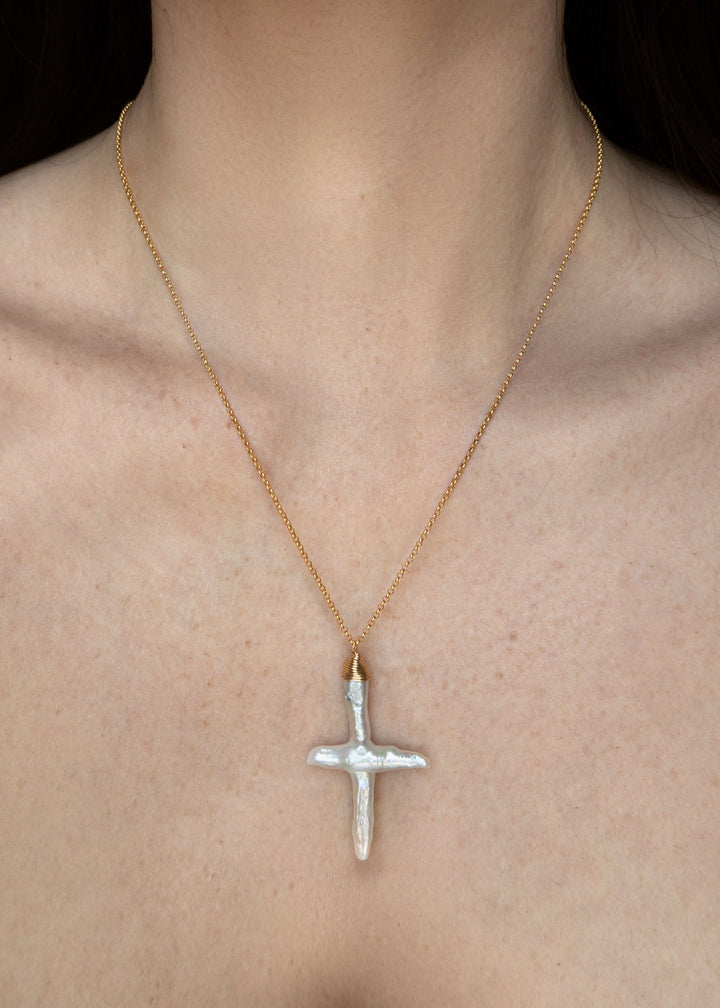 Gold-filled rolo chain with a baroque pearl cross pendant