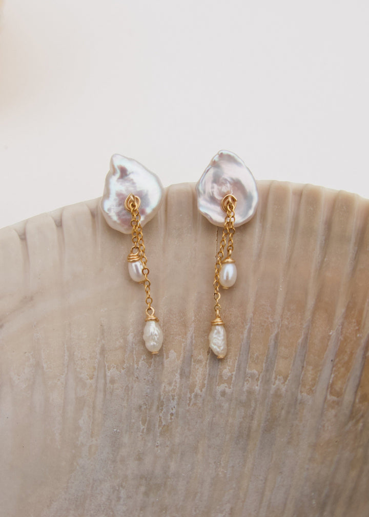 A keshi pearl earrings with gold-filled chains and dangling pearls