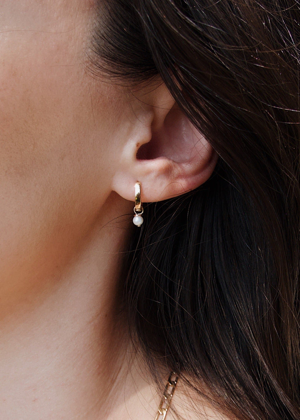 Gold-filled hoop earrings with a single seed pearl