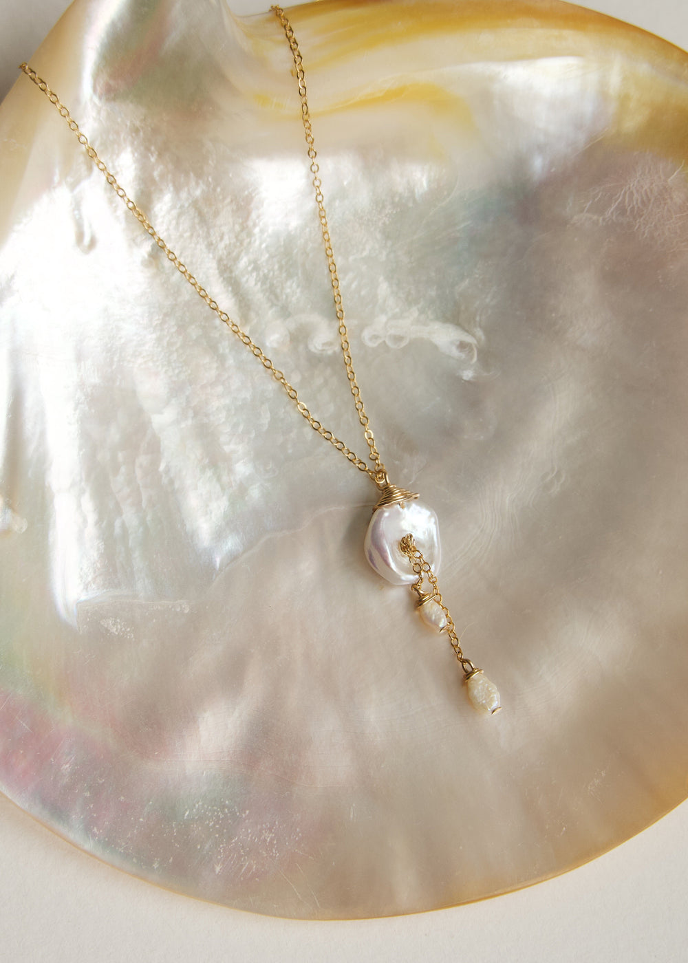 Lily Necklace - This dainty necklace is our sweet playful take on a calla lily. Simple enough to wear to work and fancy enough to wear to a wedding, you will struggle taking this beauty off. It's the perfect necklace for any occasion. 14K Gold-Filled or S