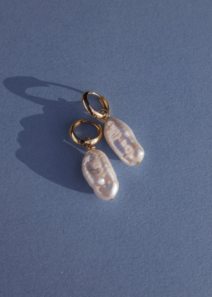 14K Ava Earrings - The perfect minimal pearl earrings. Handcrafted with a variety of gemstones and 14K gold filled hoops, these earrings are sure to become your favorite. 14K Solid Gold Tarnish-Resistant & Hypoallergenic AAA Grade Genuine Freshwater Pearl