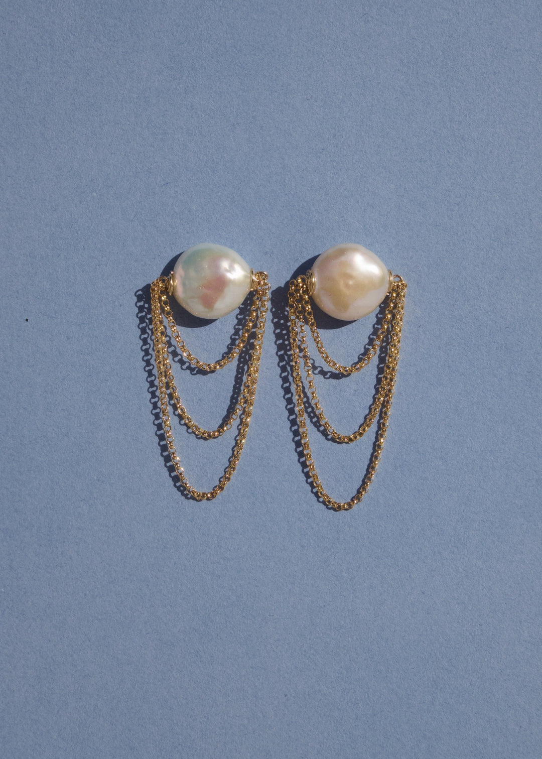 14K Dominica Earrings - Simple yet dramatic these earrings are the perfect statement piece. 14K Solid Gold Tarnish-Resistant & Hypoallergenic AAA Grade Genuine Freshwater Pearls Handmade in NJ/NY Earring Length: 2" Please note - Freshwater Pearls & Gemsto