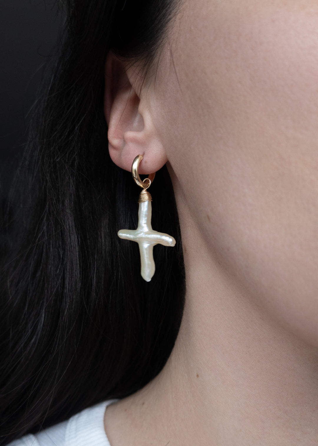 14K Gloria Earrings - Made with baroque pearl crosses, our Gloria Earrings are a unique and elegant look. These earrings will remain a beloved accessory for years to come. 14K Solid Gold Tarnish-Resistant & Hypoallergenic AAA Grade Genuine Freshwater Pear