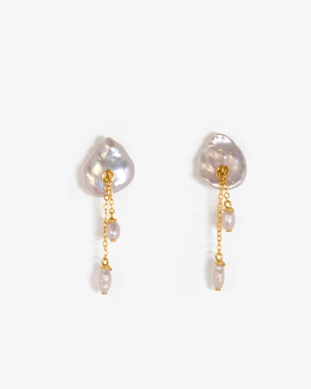 Lily - These earring are our sweet playful take on a calla lily. Simple enough to wear to work and fancy enough to wear to a wedding, its no wonder these are one of our top selling earrings. 14K Gold-Filled or Sterling Silver Tarnish-Resistant & Hypoaller