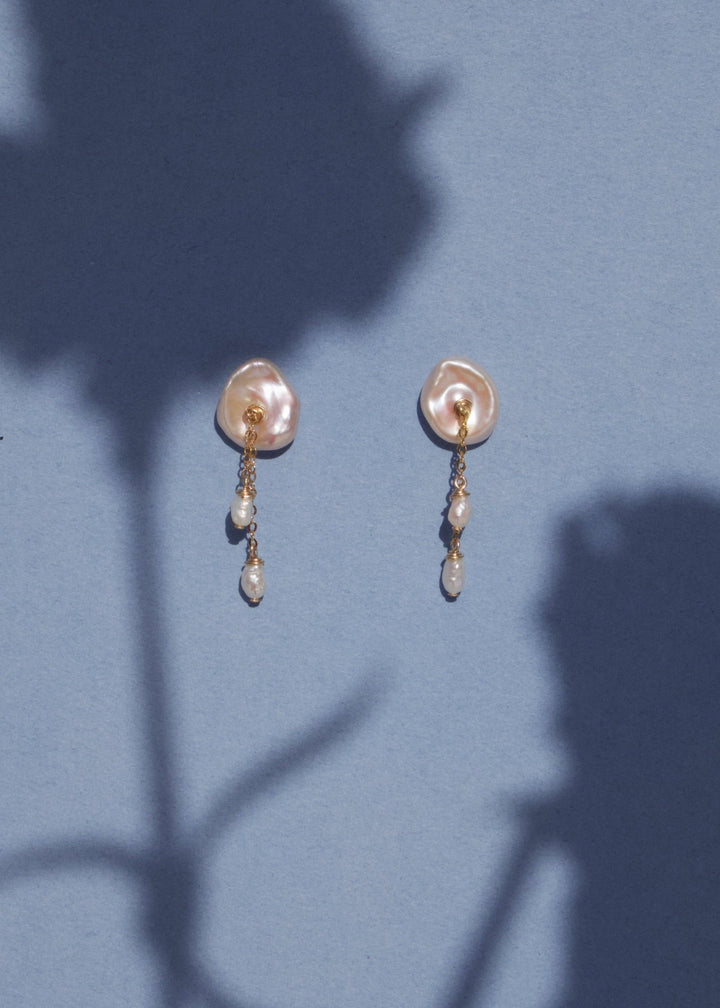 14K Lily - These earring are our sweet playful take on a calla lily. Simple enough to wear to work and fancy enough to wear to a wedding, its no wonder these are one of our top selling earrings. 14K Solid Gold Tarnish-Resistant & Hypoallergenic AAA Grade