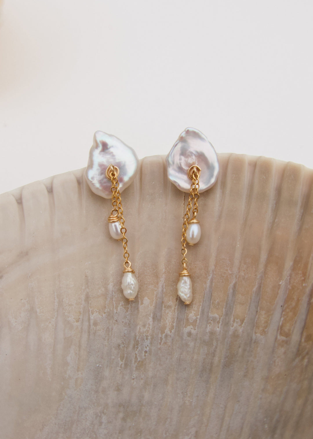 Lily - These earring are our sweet playful take on a calla lily. Simple enough to wear to work and fancy enough to wear to a wedding, its no wonder these are one of our top selling earrings. 14K Gold-Filled or Sterling Silver Tarnish-Resistant & Hypoaller