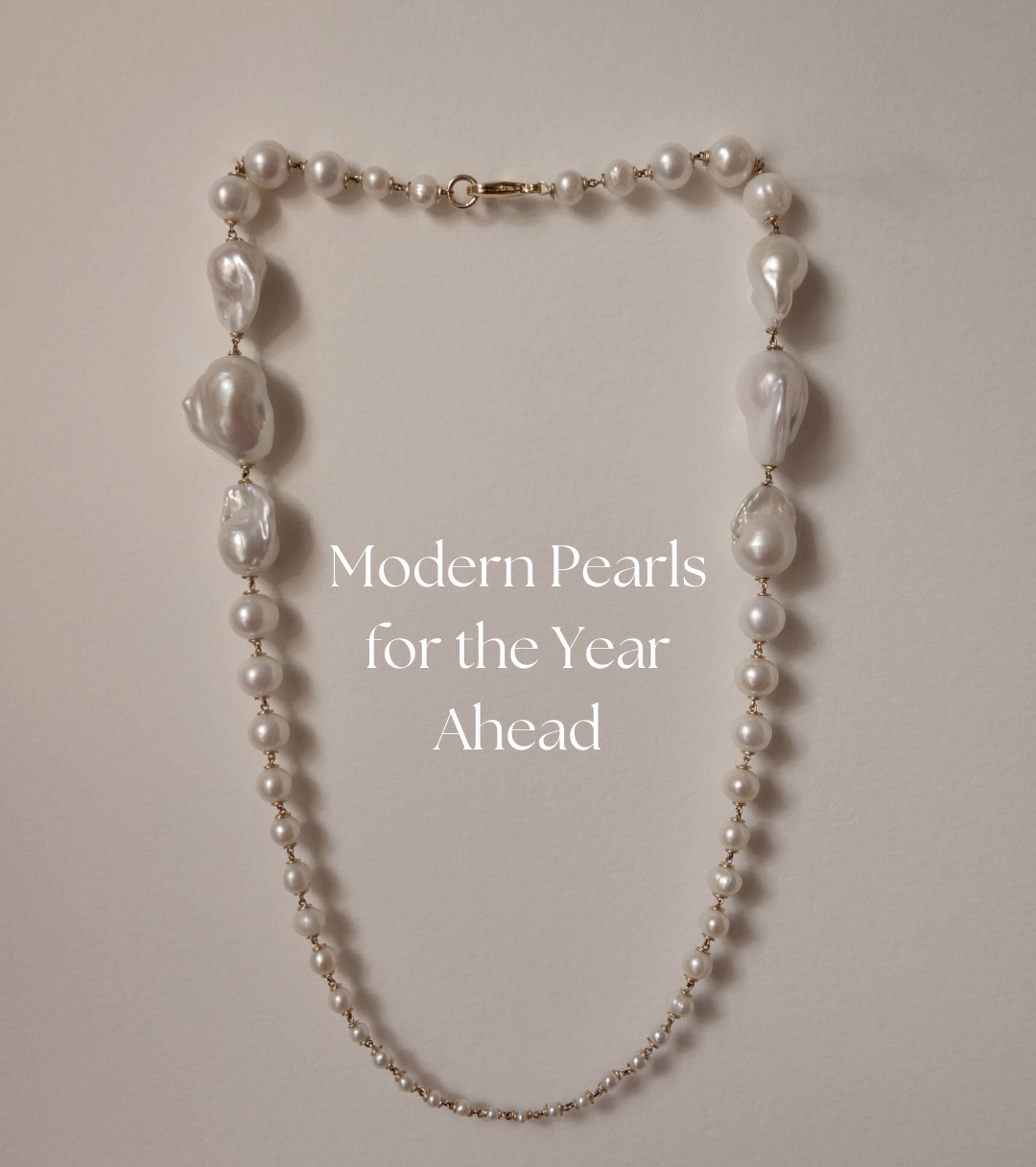 Pearl necklace on a plain background with text overlay