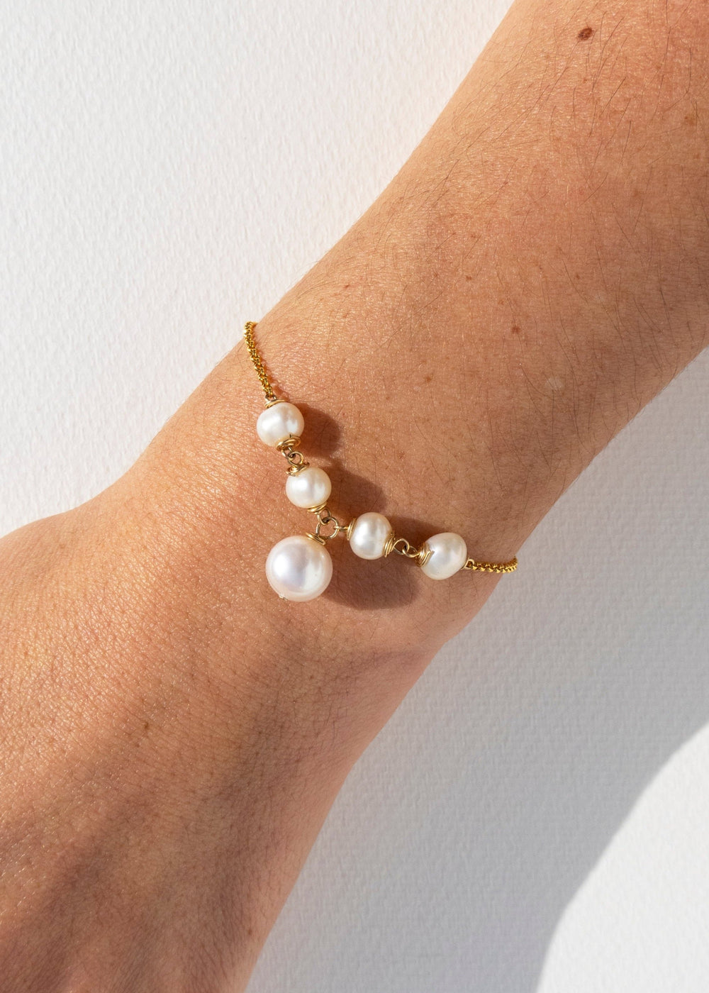 Gold-Filled bridal bracelet with classy white pearls on hand