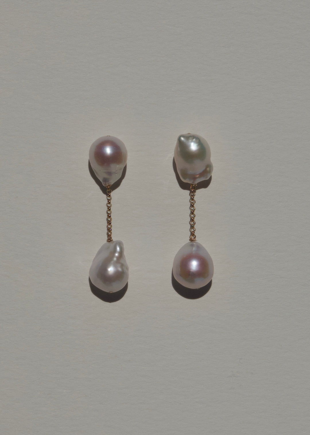 Anya earrings, vertical baroque pearl drops on a short gold chain