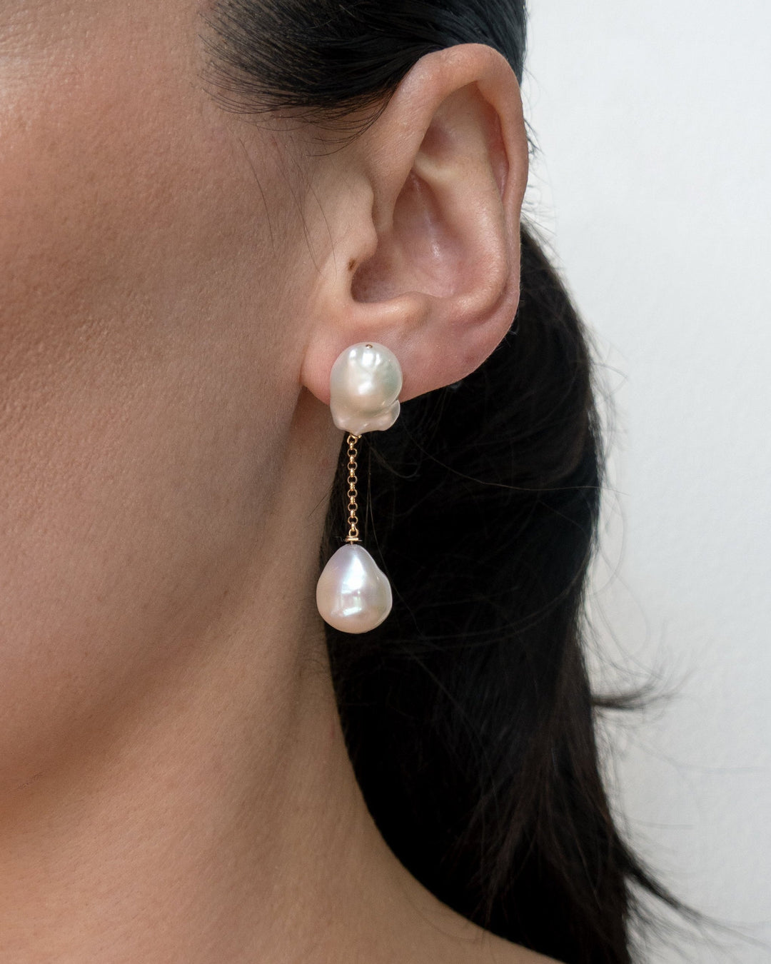 Anya earrings worn on a model's ear