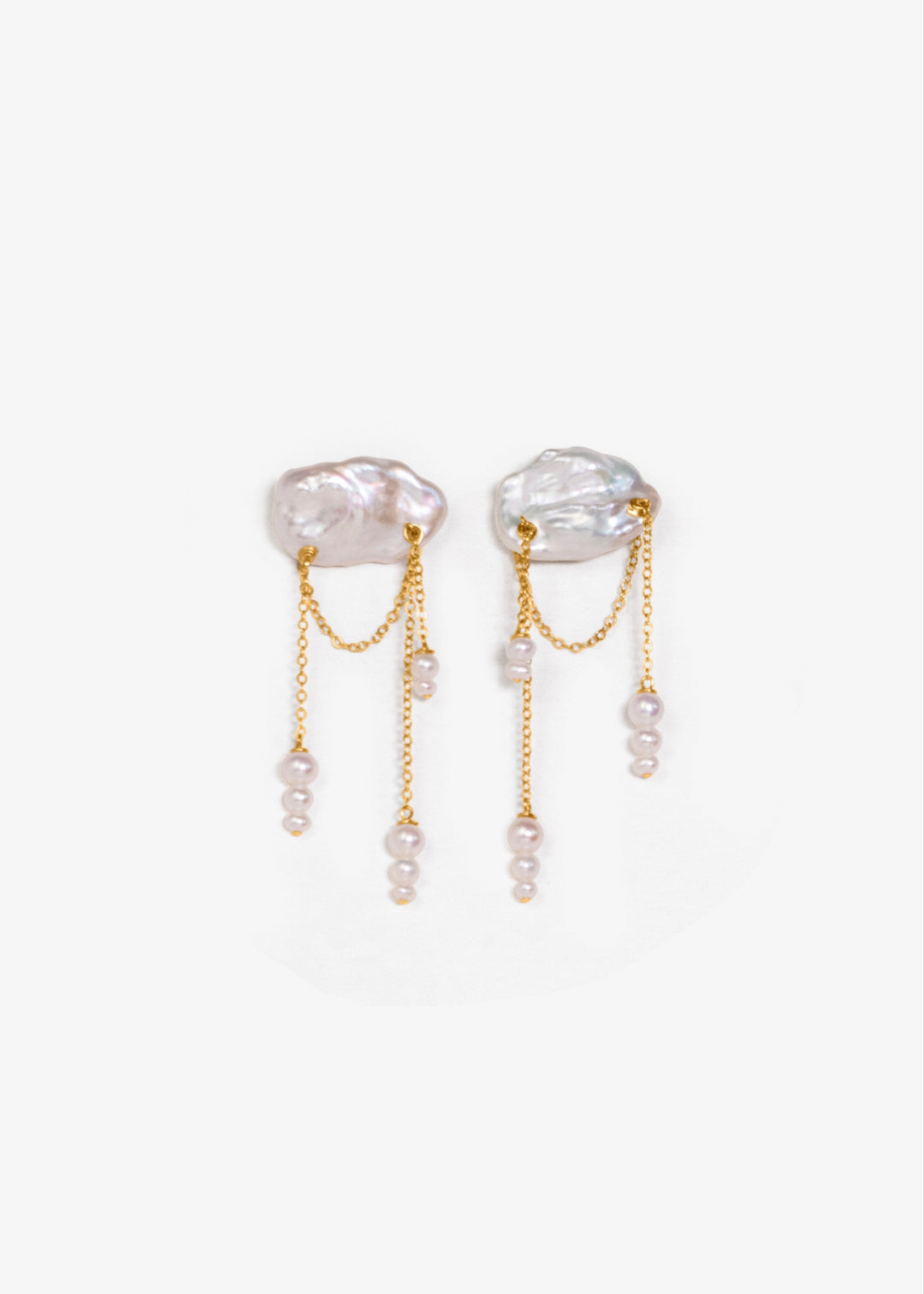 Solid gold earrings with a keshi pearl and dangling seed pearls
