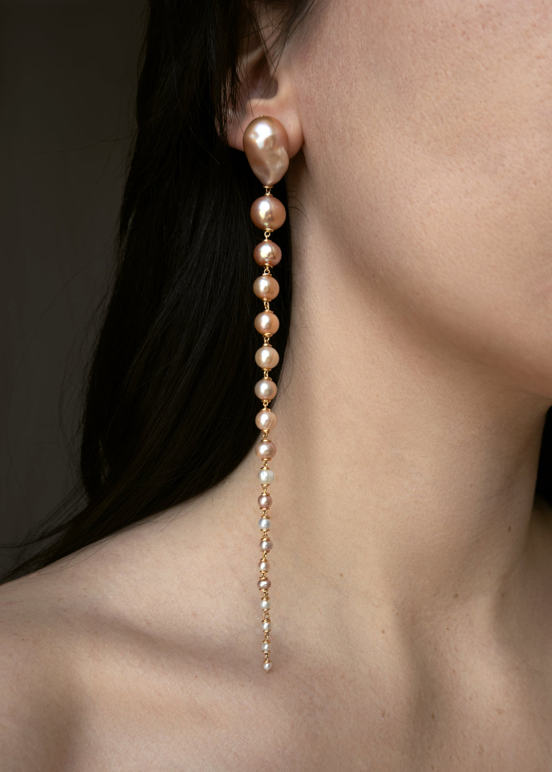 Azalea - Crafted with baroque pink or white pearls that taper into delicate white seed pearls, these earrings are a bold blend of femininity and edge. Striking in every sense, they command attention with their unexpected silhouette. 14K Gold-Filled Tarnis