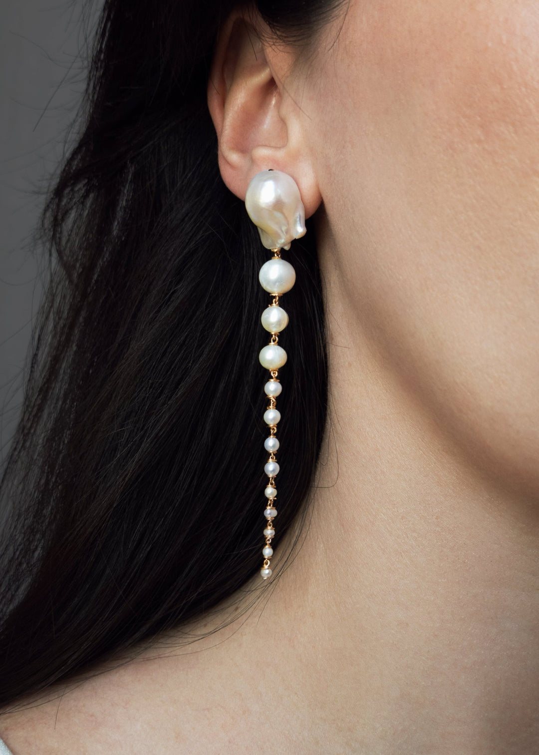 Azalea Petite - A more delicate take on a dramatic favorite. This petite version features baroque white pearls that taper into fine white seed pearls, creating a softer silhouette that still catches the eye. Refined and romantic, with just enough edge to