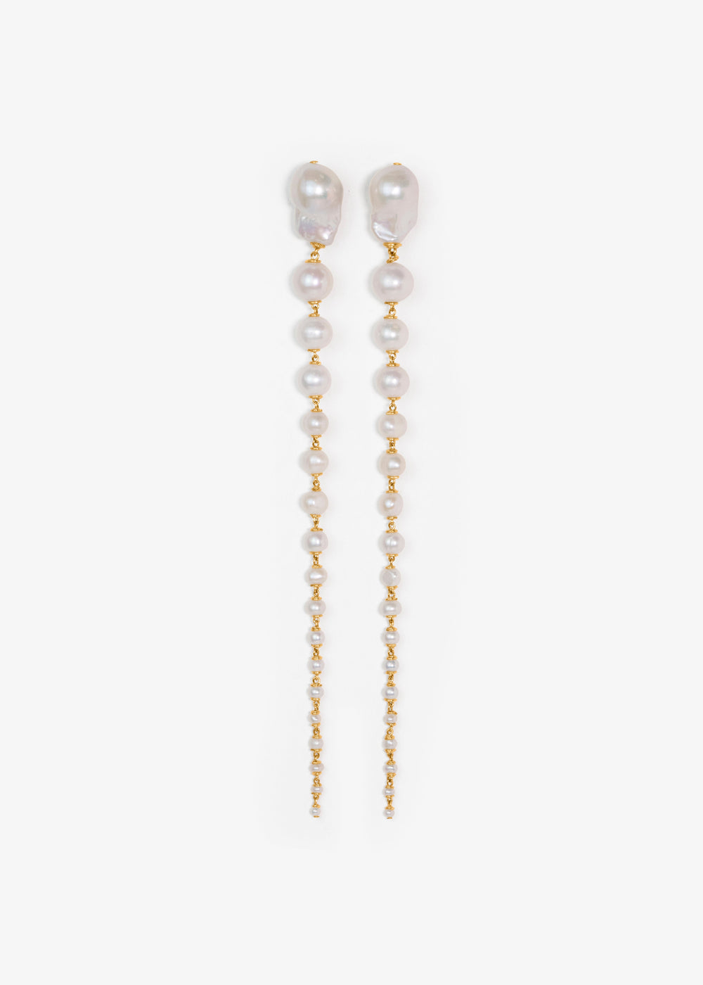 Pair of pearl and gold chain earrings on a white background