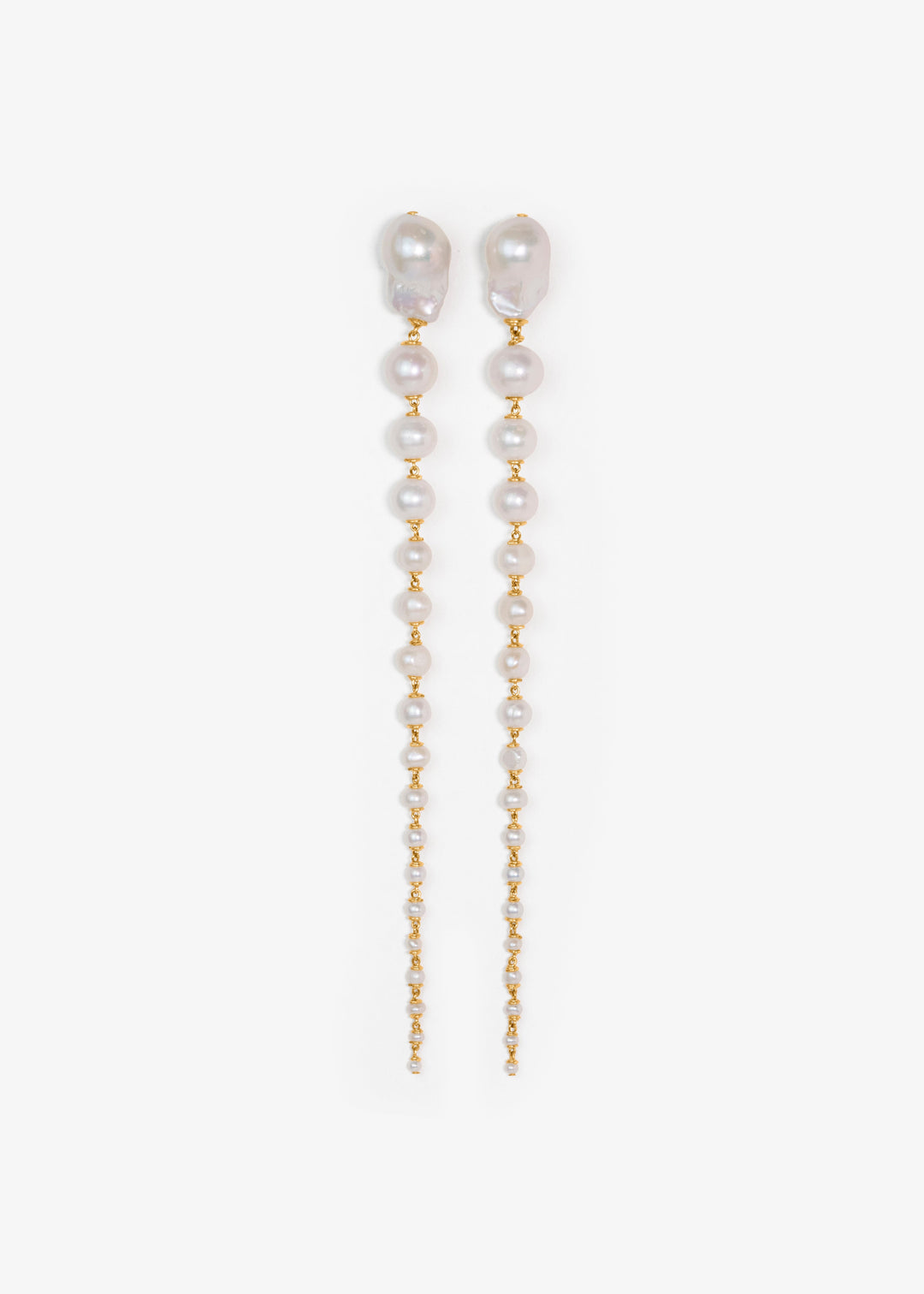 Pair of pearl and gold chain earrings on a white background