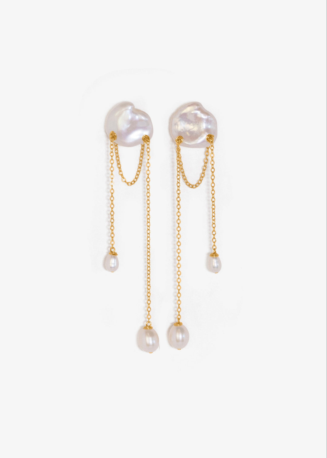 Bria - A single keshi pearl anchors this delicate design, with two fine strands falling at varied lengths. Between them, a single gold chain is draped like a quiet detail you almost missed. Graceful and understated, it’s a perfect choice for a wedding or