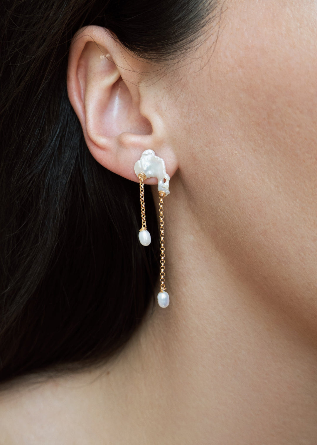 Bridges - Inspired by the natural arches carved into coastal cliffs, these earrings echo the quiet strength of time and tide. Asymmetrical keshi pearls form soft, irregular bridges, each one unique, with subtle curves and texture. From beneath them, rolo