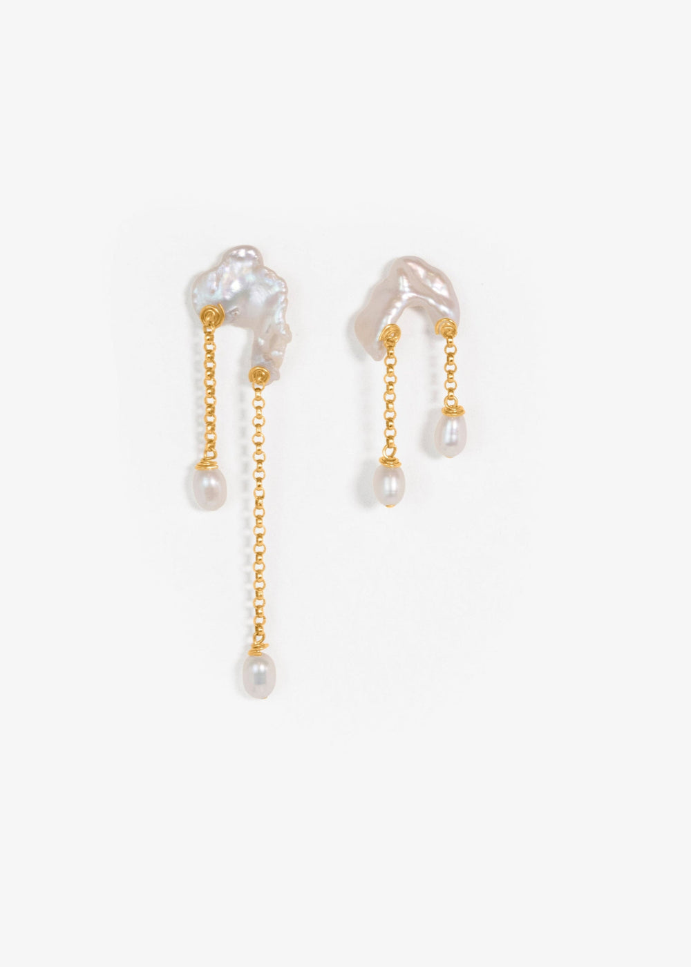 Bridges - Inspired by the natural arches carved into coastal cliffs, these earrings echo the quiet strength of time and tide. Asymmetrical keshi pearls form soft, irregular bridges, each one unique, with subtle curves and texture. From beneath them, rolo
