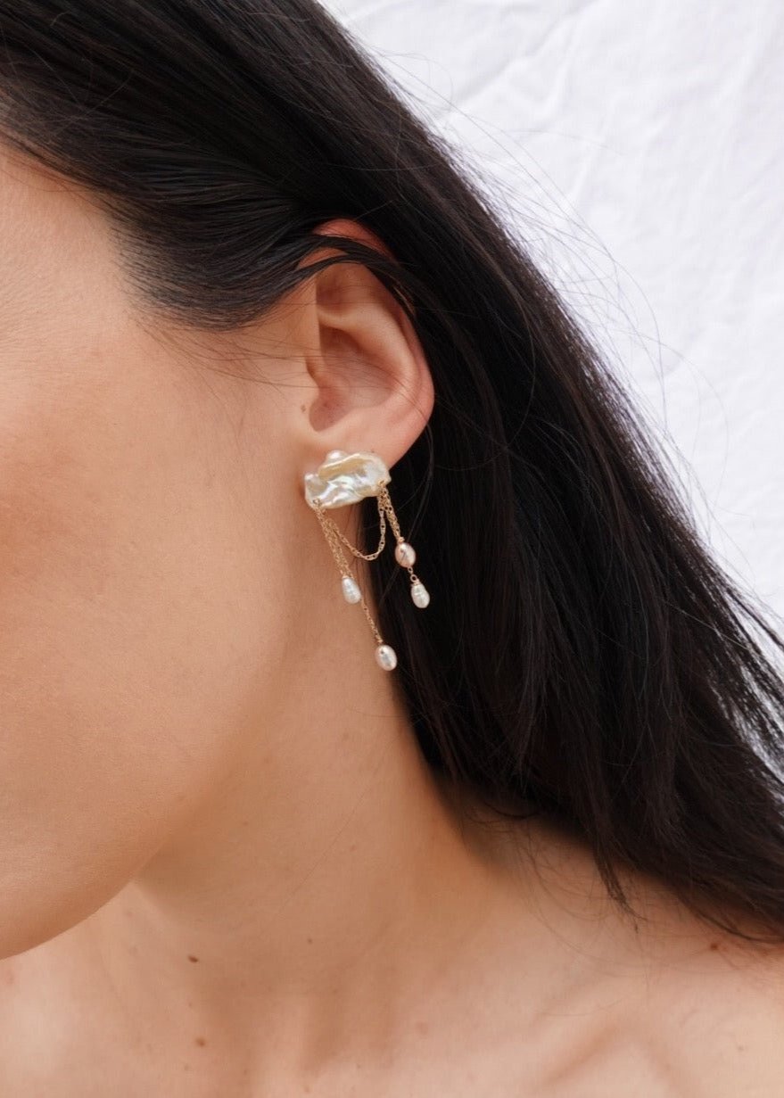 Stunning earrings featuring keshi and baroque pearls with gold chain