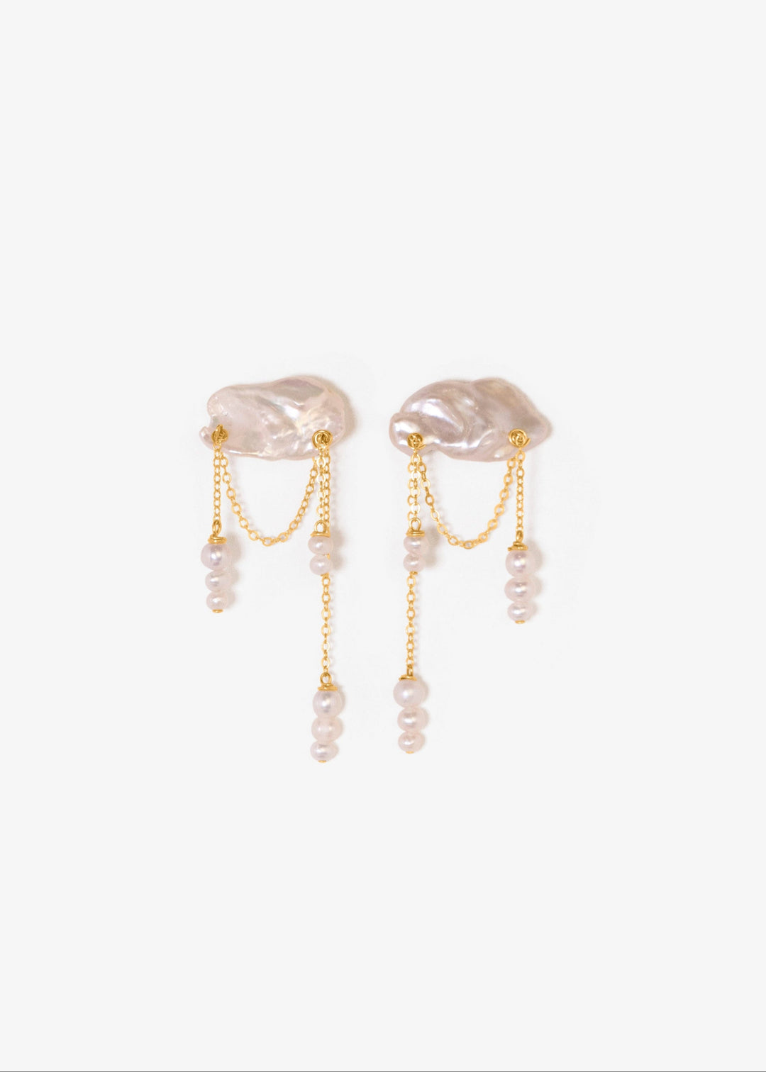 Solid gold earrings with a keshi pearl and dangling seed pearls