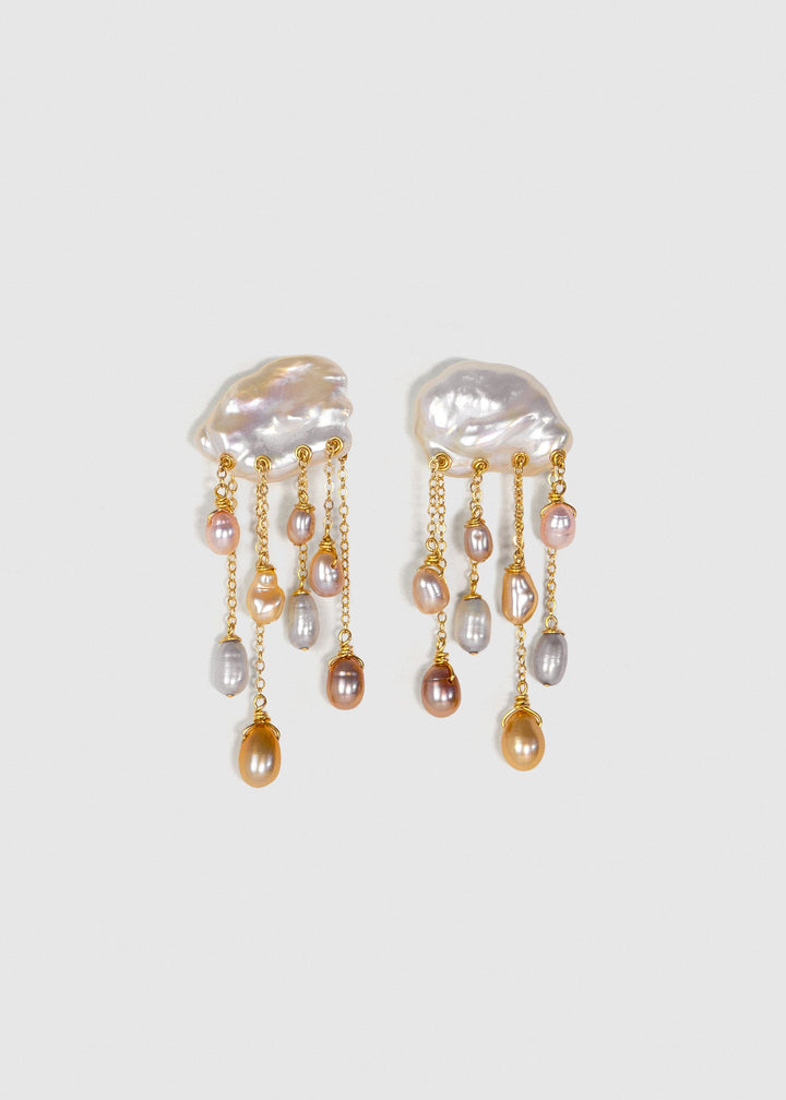 Daydream 14k gold earrings with irregular freshwater keshi pearl tops and cascading multicolored teardrop pearls on a light background.