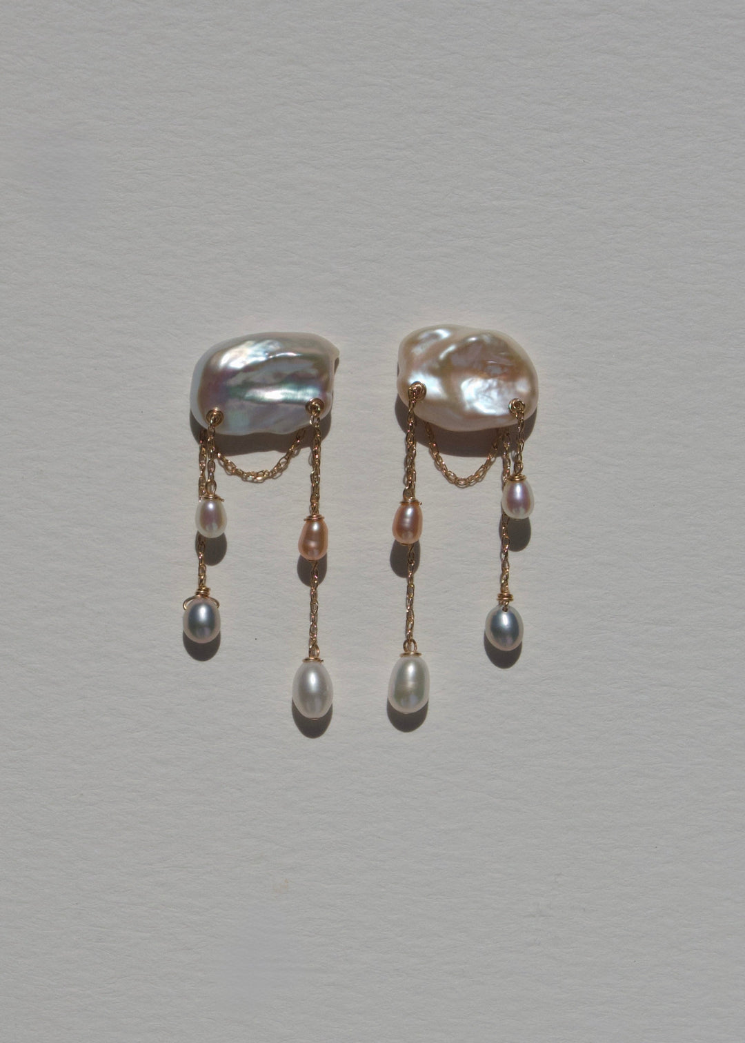Dove earrings, keshi pearl studs with staggered gold chains and mixed pearl drops