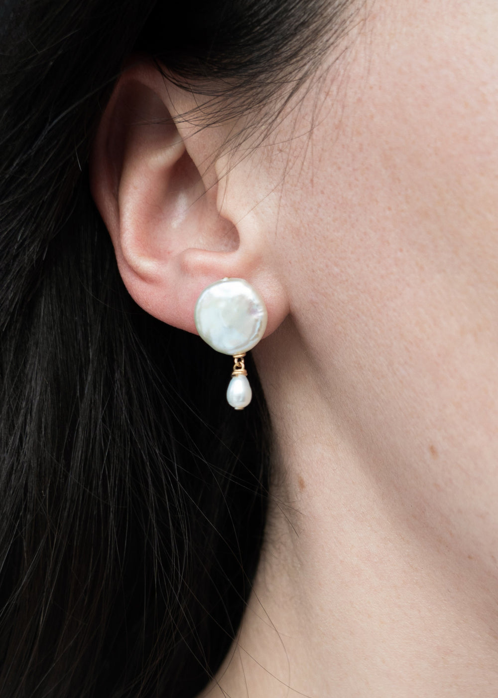 Solid gold mini earrings with a white coin pearl and a dainty pearl