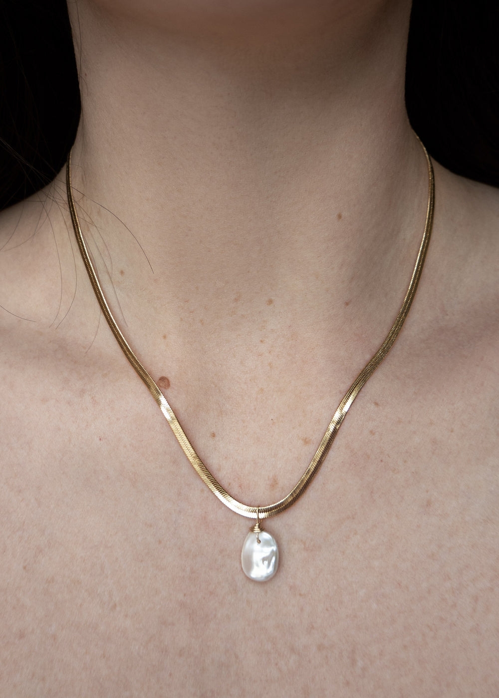 A large keshi pearl necklace with  sleeky solid gold chain