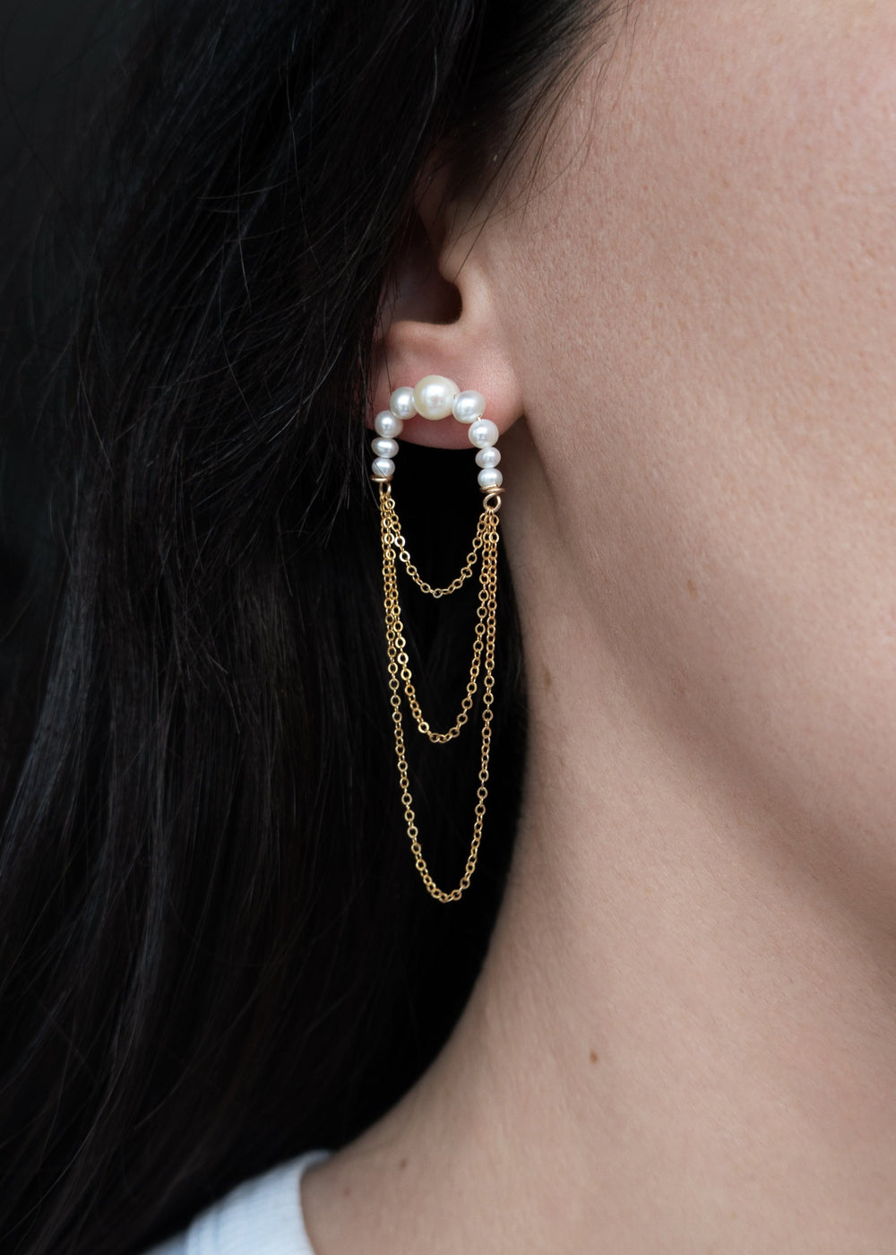 Earring with three layered gold-filled chains and attached descending pearls