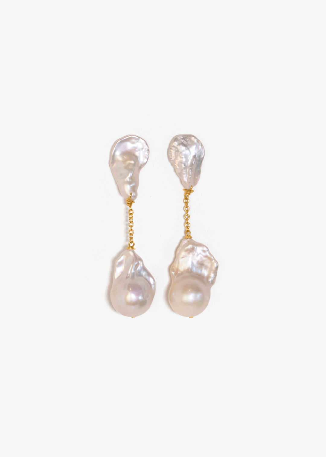 Fiora - These earrings feature sharp, angular keshi pearls with rugged, sculptural shapes that command attention. From a substantial chain, two large fireball pearls hang gracefully, creating a striking and bold silhouette. 14K Solid Gold Freshwater Baroq
