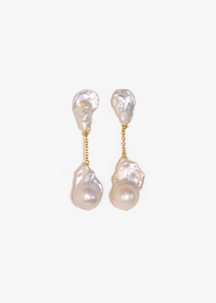 Fiora - These earrings feature sharp, angular keshi pearls with rugged, sculptural shapes that command attention. From a substantial chain, two large fireball pearls hang gracefully, creating a striking and bold silhouette. 14K Solid Gold Freshwater Baroq