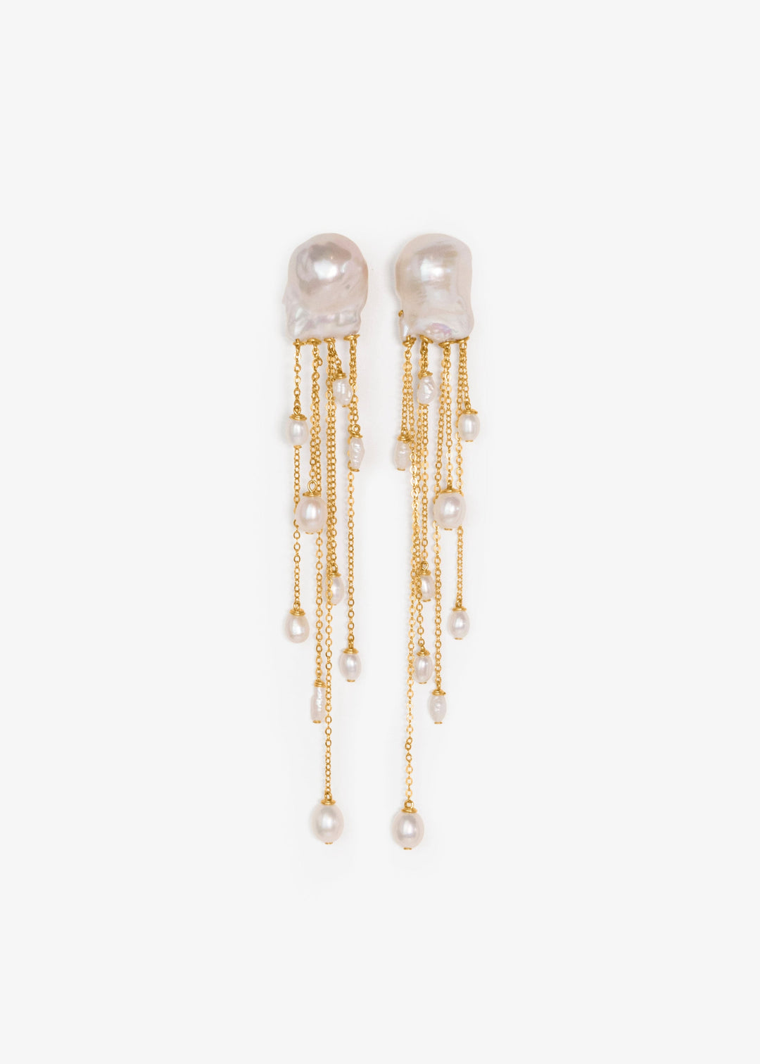 Gia - Like something drifting just beneath the surface, delicate, fluid, and quietly striking. Two baroque pearls anchor cascading chains of varied lengths, each adorned with luminous pearls in unexpected shapes. At four inches long, they move with ease a