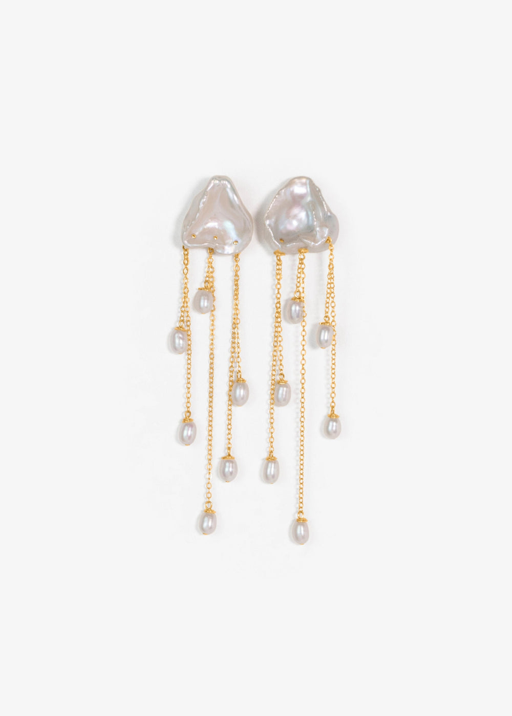 Inez - Two luminous keshi pearls anchor these earrings, imperfect in shape, yet perfectly matched. Their sculptural forms and 14k gold chains create a balanced silhouette that feels both refined and untamed. Delicate, dramatic, and made to frame the face