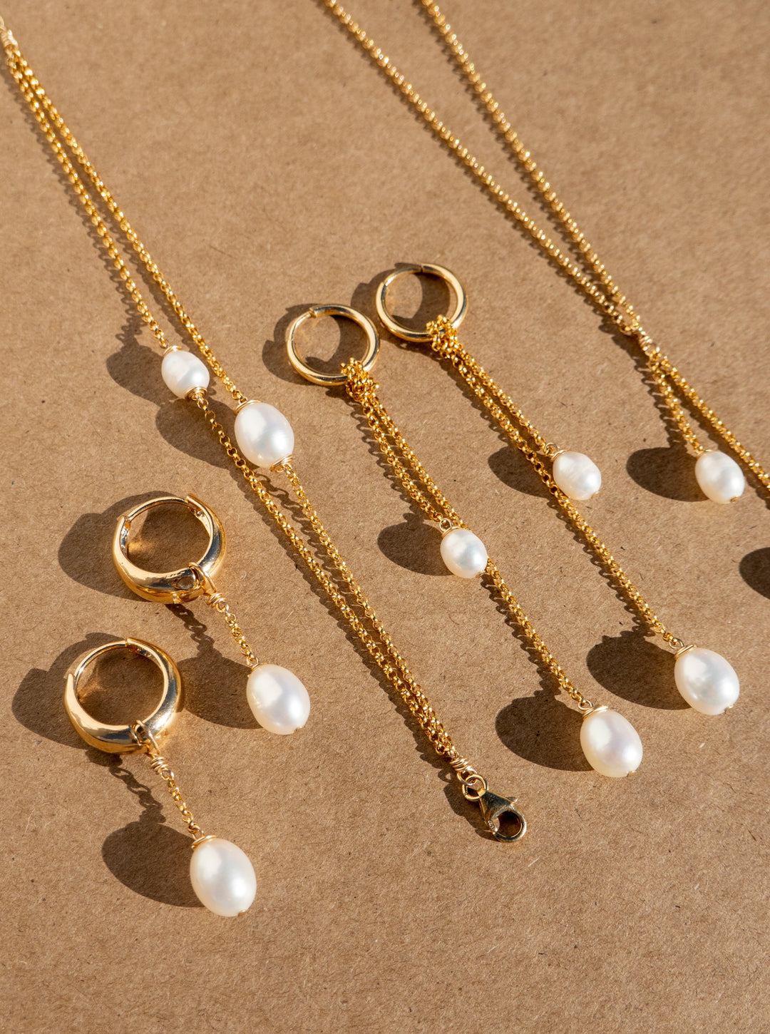 Bracelets and earrings with gold-filled rolo chain and tear drop pearls