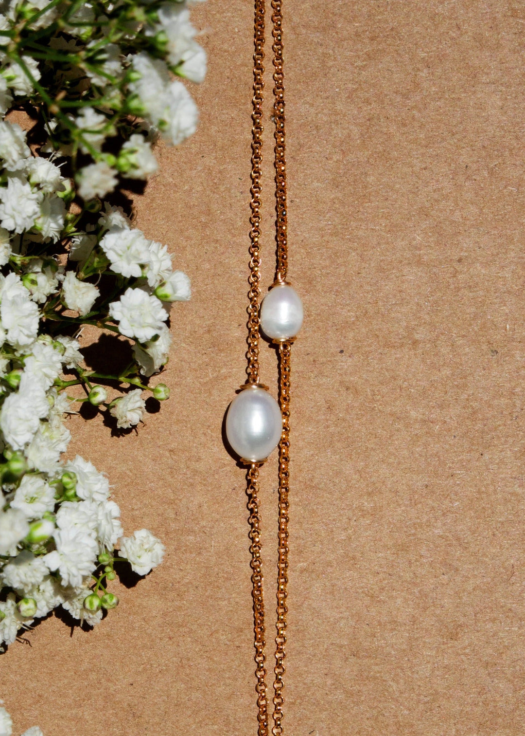 Gold-filled bracelet with two different sized tear drop pearls