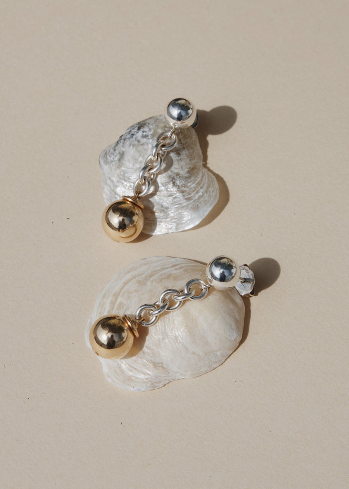 Sterling silver earrings with gold bead