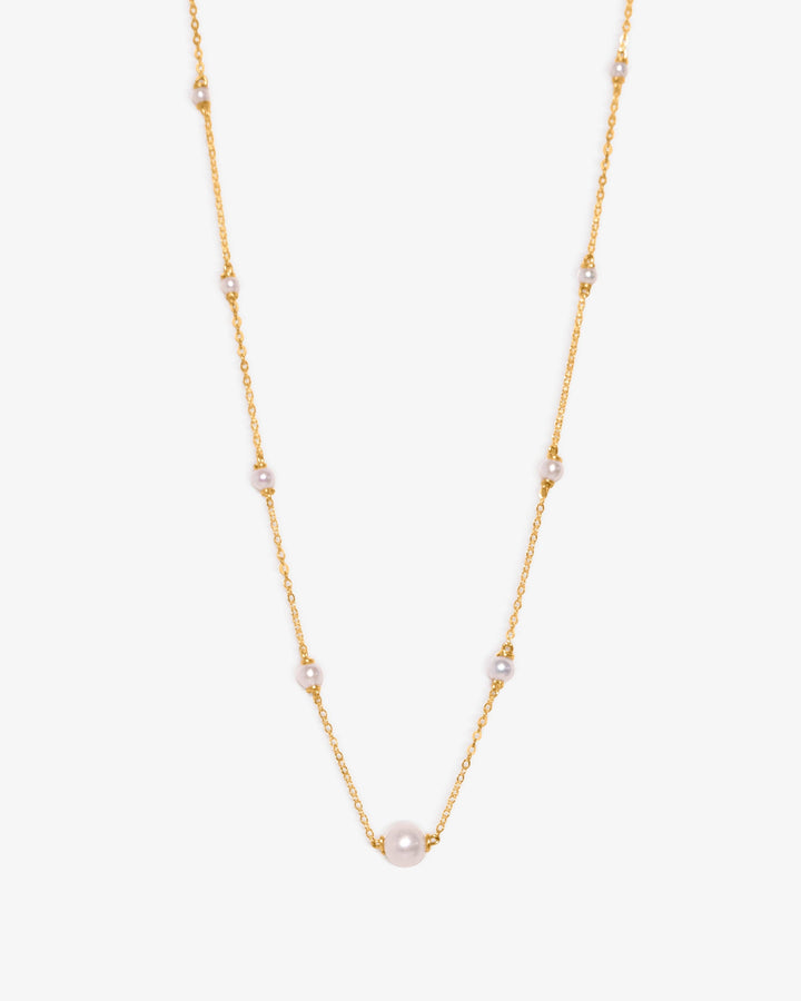 Gold necklace on a white background