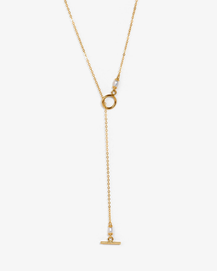Liv Necklace - This pearl necklace features delicate, small pearls and a dainty chain, offering a minimalist yet timeless look. Finished with a chic toggle clasp, it effortlessly blends modern design with classic sophistication. 14K Gold-Filled Metals Tar