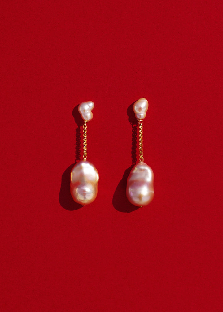 Lyra - Suspended from a delicate round box chain, luminous pink baroque pearls bring a touch of soft sophistication. Their irregular forms catch the light beautifully, celebrating individuality in every detail. 14K Solid Gold Pink Freshwater Baroque Pearl