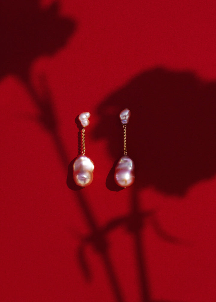 Lyra - Suspended from a delicate round box chain, luminous pink baroque pearls bring a touch of soft sophistication. Their irregular forms catch the light beautifully, celebrating individuality in every detail. 14K Solid Gold Pink Freshwater Baroque Pearl