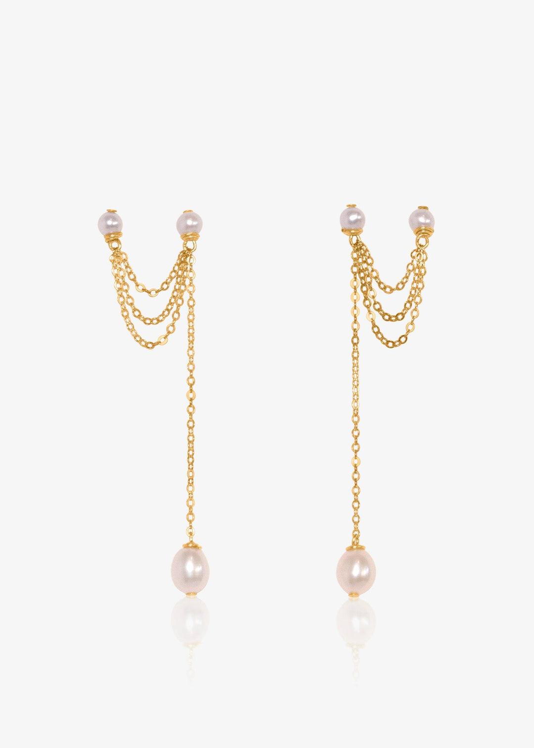 Gold chain earrings with pearl drops on a white background