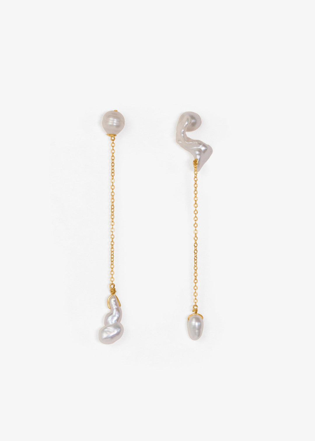 Nova - These asymmetrical earrings feature a crescent-shaped pearl on one side, evoking the delicate curve of the moon. Dainty chains hang from each end, with a teardrop pearl dangling at the bottom, creating an elegant design that balances softness and c