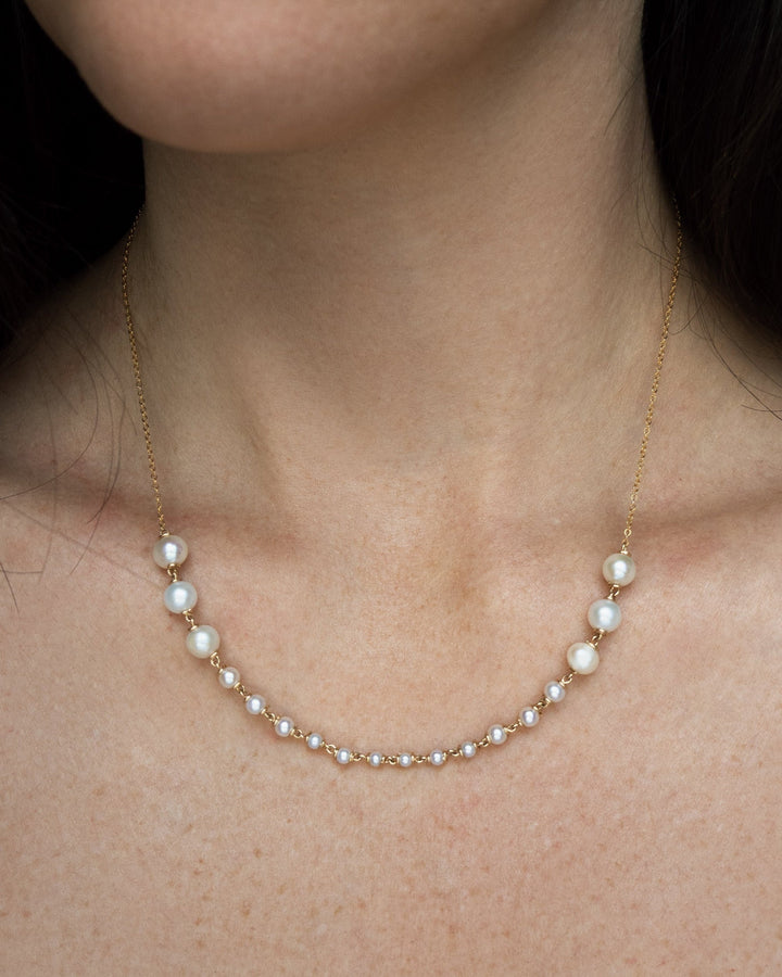 Odette Necklace - Lustrous pearls graduate from large to small toward the center front, meeting a sleek, reflective chain. The Odette is refined yet easy to wear, perfect from day to evening. 14K Gold-Filled Metals Tarnish-Resistant &amp; Hypoallergenic AAA G