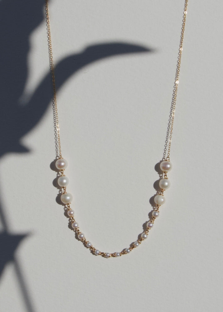 Odette Necklace - Lustrous pearls graduate from large to small toward the center front, meeting a sleek, reflective chain. The Odette is refined yet easy to wear, perfect from day to evening. 14K Gold-Filled Metals Tarnish-Resistant &amp; Hypoallergenic AAA G