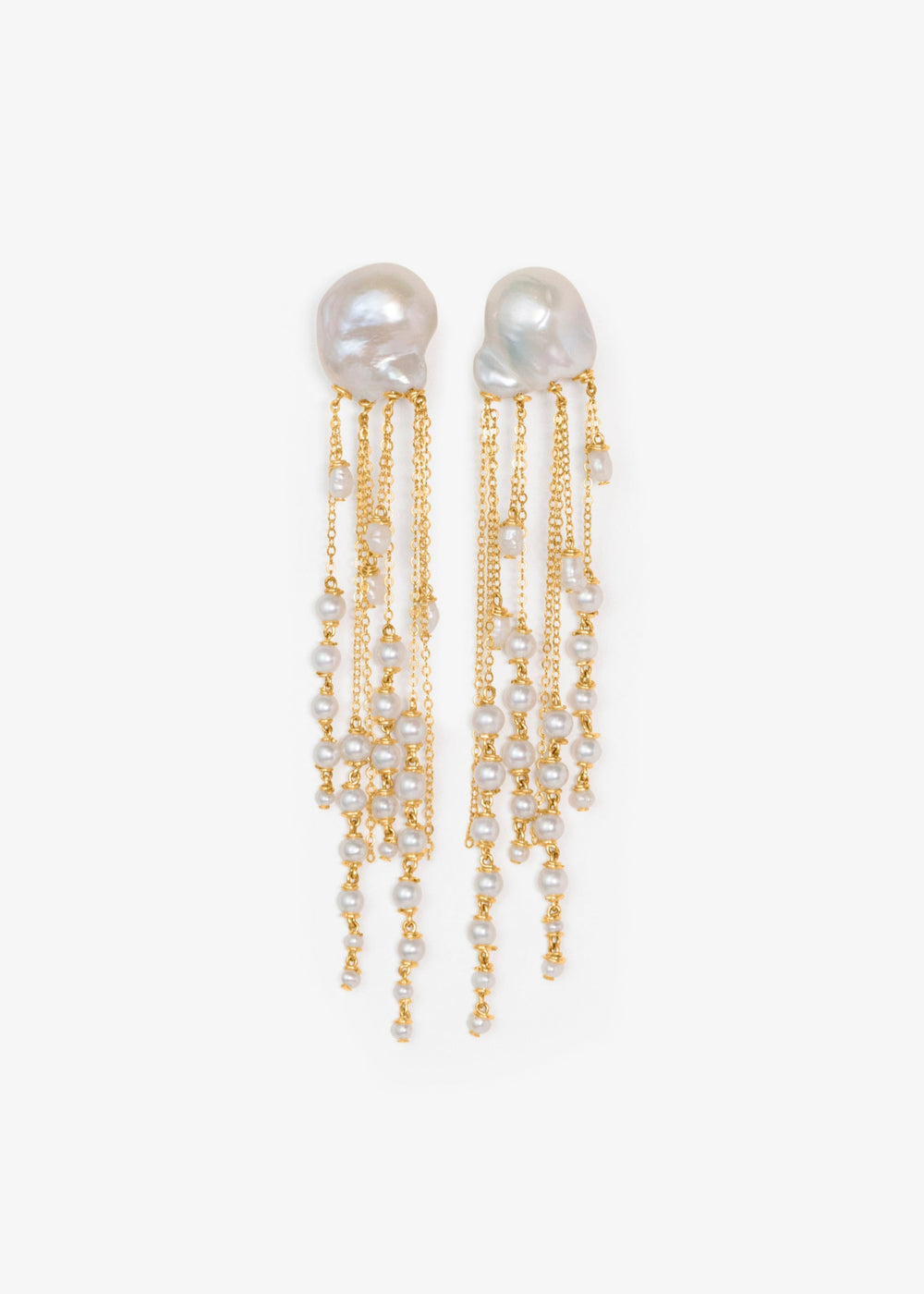 Opal - There’s a rhythm to these earrings. Fluid and mesmerizing, like the pull of the ocean. Eight strands of seed pearls taper gently downward, floating alongside draped gold chains that shimmer with every step. At nearly four inches long, they’re bold