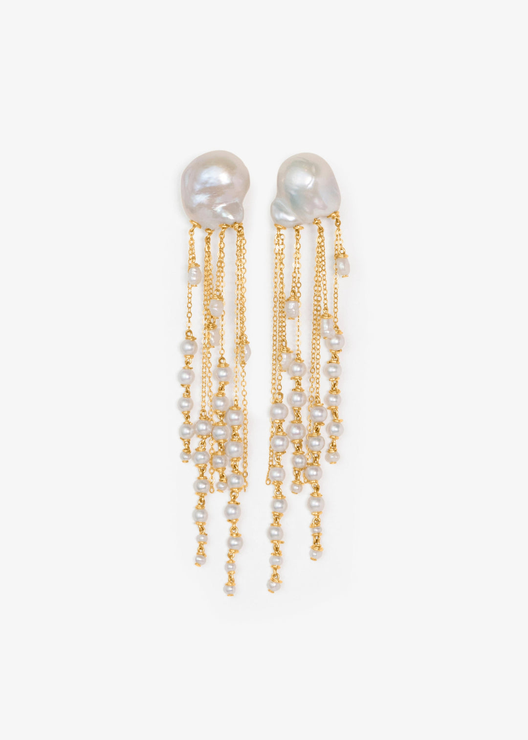 Opal - There’s a rhythm to these earrings. Fluid and mesmerizing, like the pull of the ocean. Eight strands of seed pearls taper gently downward, floating alongside draped gold chains that shimmer with every step. At nearly four inches long, they’re bold