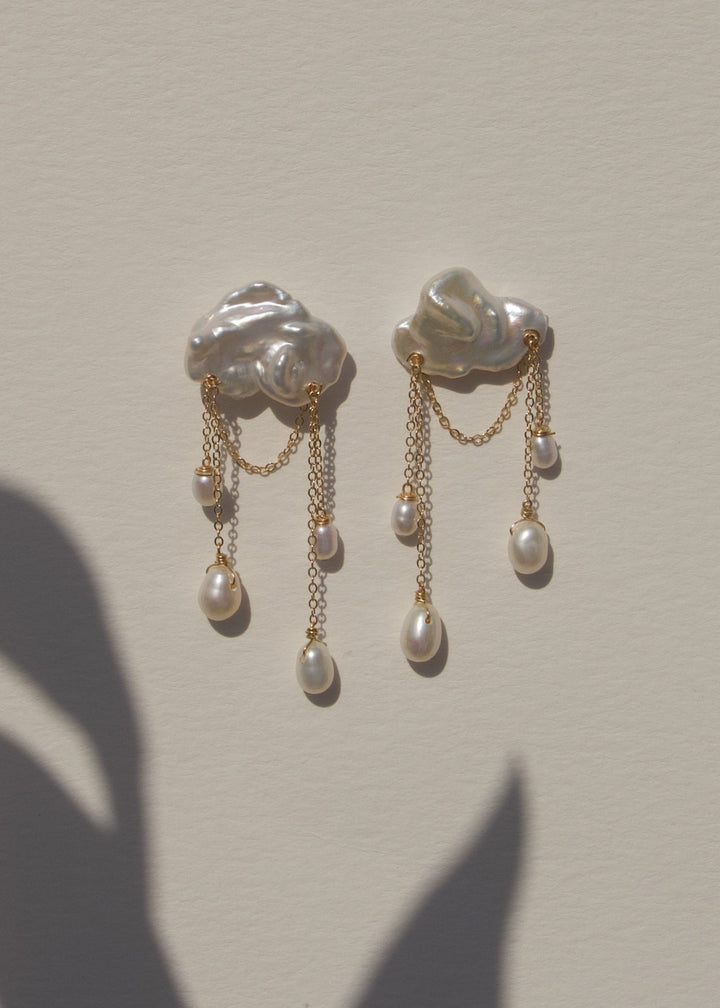 Solid gold earrings with a keshi pearl and dangling teardrop pearls