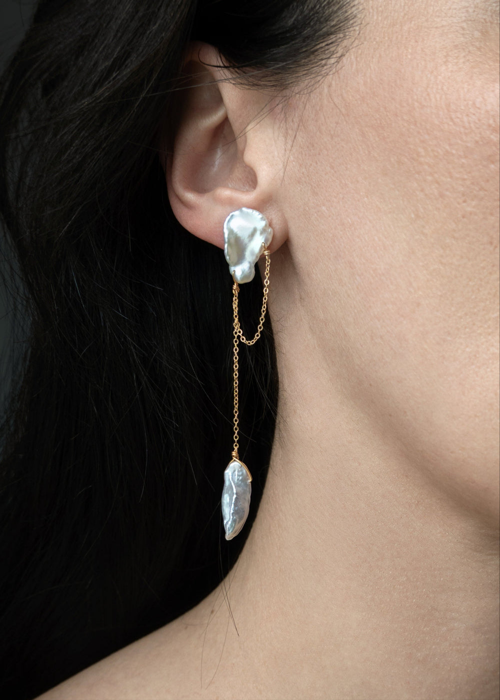 Solid gold earring with different shaped keshi pearls