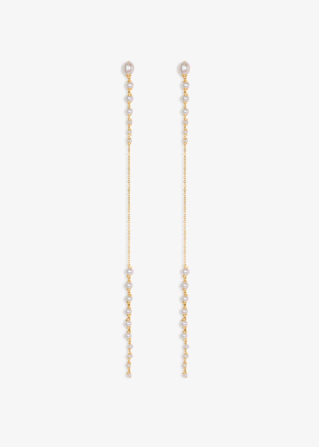 Posy - Minimal by design, but quietly captivating. These long earrings feature tapered strands of seed pearls, graduating from large to small, framing a single, reflective chain at the center. The effect is delicate yet striking, with just enough shimmer